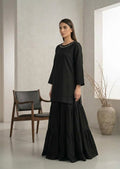 Three-quarter view of black kurta and matching tiered skirt